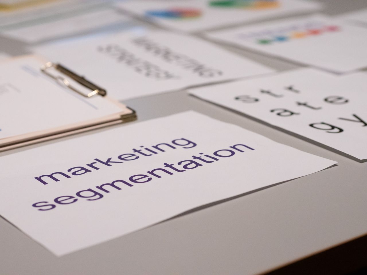 Close-up of various marketing documents on a desk, perfect for business and strategy discussions.